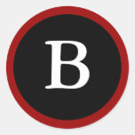 B : Lettre initiale autocollant rouge, blanc et no