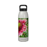 Bouteille rouge lumineuse de liberté de fleur