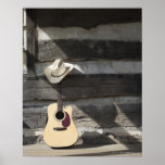 Chapeau de cowboy sur la guitare se penchant sur l posters