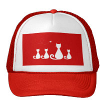 Chat de mère avec des chatons casquettes
