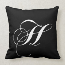 Coussin décoré d'un monogramme de concepteur blanc