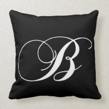Coussin décoré d'un monogramme de concepteur blanc