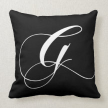 Coussin décoré d'un monogramme de concepteur blanc