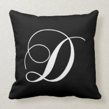Coussin décoré d'un monogramme de concepteur blanc