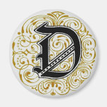 ` D de monogramme' en or - aimant