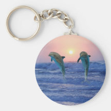 Dauphins au lever de soleil porte-clef