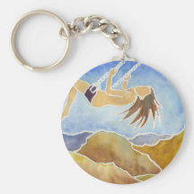Femme sur une oscillation au-dessus des collines porte-clef