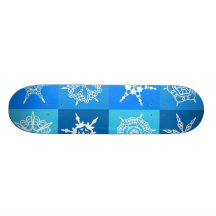 Flocons de neige blancs dans des boîtes bleues skateboards