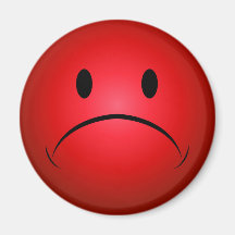 Frownie rouge font face à l'aimant