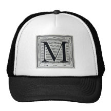 Initiale de bois de graveur de gravure sur bois en casquettes de camionneur