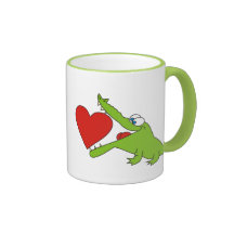 Je t'aime, crocodile mignon avec une tasse de coeu
