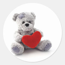 Jouet d'ours de nounours tenant un coeur sur l'arr adhésifs ronds