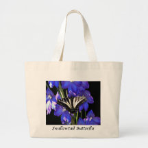 Papillon de machaon sur des delphiniums sac de toile