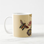 Papillons et tasse de fleurs
