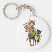 Petits chats adorables soutenant des cadeaux porte-clés