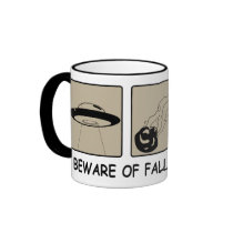 Prenez garde de la tasse en baisse en verre d'obje