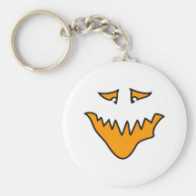 Visage effrayant. Grimace orange de monstre Porte-clé