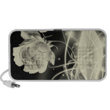 Whisps rougeoyant abstrait et fleurs dans l'espace haut-parleur ordinateur portable