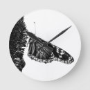 Recherche de papillon noir blanc horloges Ailes
