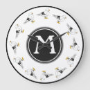 Recherche de oiseau noir et blanc horloges Plage