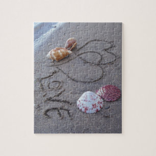 2 Harten in zand met schelpen met liefde Legpuzzel