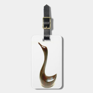 À Bagage étiquette d'oiseau sculpté