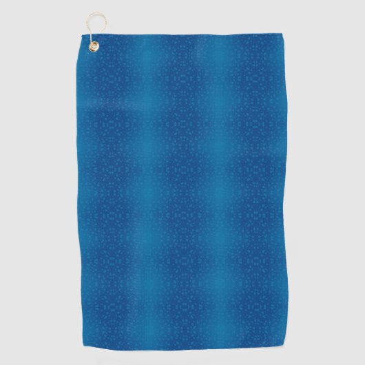 A blue towel with a subtle dotted pattern hangs  golfhanddoek (Voorkant)