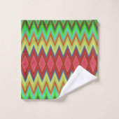 A colorful, geometric-patterned towel set hangs (Gant de toilette)