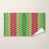 A colorful, geometric-patterned towel set hangs bad handdoek (Handdoek)