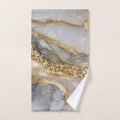 A luxurious gold and white marble background (Serviette à main)
