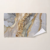 A luxurious gold and white marble background (Serviette à main)