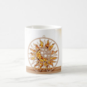 a white mug with an image of sun and moon