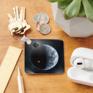 Aardachtige planeet met oceanen die zijn oppervlak sleutelhanger