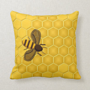 Abeille sur un coussin d'accent de nid d'abeilles