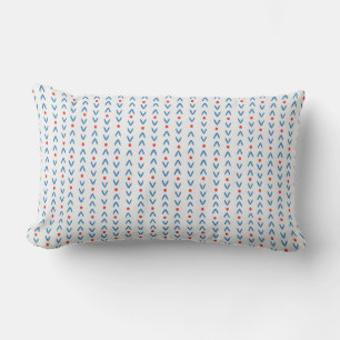 Abstract naadloos patroon in blauw en rood op crèm kussen