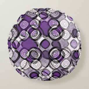 Abstract paars, grijs en zwart cirkelpatroon rond kussen