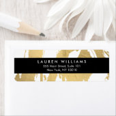 Abstracte Faux Gold-penseelstreken op wit Etiket (Insitu)