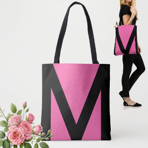 Abstracte geometrische vorm in zwart en neonroze draagtas