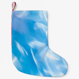 Abstracte glitterlichten op blauwe achtergrond. Ro Kleine Kerstsok