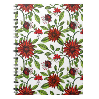 abstracte rode bloemen en groene bladeren op witte notitieboek