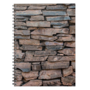 Achtergrondabstract van de oude steenwandtextuur, notitieboek