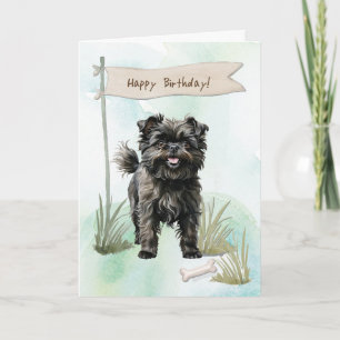 Affenpinscher fokt hond onder verjaardagsbord kaart