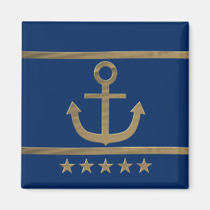 Aimant ancre or sur arrière - plan bleu marine
