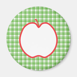 Aimant Apple rouge. Avec le fond vert et blanc de