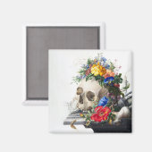 Aimant avec crâne et scène de fleurs. (Recto/Verso)