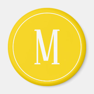 Aimant Blanc de monogramme sur l'aimant rond jaune d'or