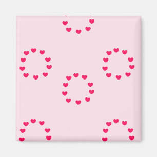 Aimant cercles de coeur rouge sur rose