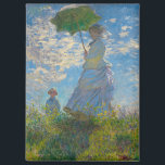 Aimant Claude Monet Femme avec un parasol<br><div class="desc">Ajoutez la beauté impressionniste à votre vue quotidienne. Cet aimant rectangulaire présente la Femme de Claude Monet avec un Parasol, peint en bleu clair, blanc doux et vert frais. La scène gracieuse mère et enfant, capturée dans des coups de pinceau lumineux, apporte un charme intemporel aux réfrigérateurs, casiers ou planches...</div>