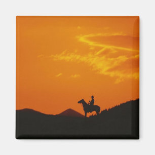 Aimant Coucher de soleil orange avec silhouette Cowboy