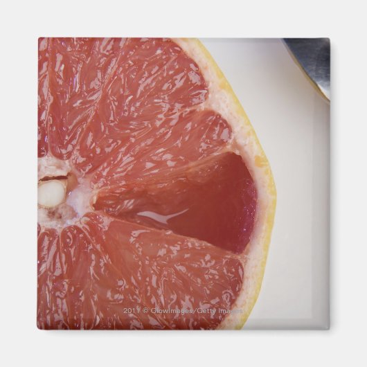 Aimant Gros plan d'une tranche d'orange et une cuillère (Devant)